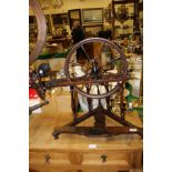 A 19th Century Continental beech and fruitwood table top spinning wheel with baluster turned