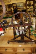 A 19th Century Continental beech and fruitwood table top spinning wheel with baluster turned