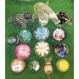 A collection of fourteen various paperweights to include animals, Pegasus, ball on stand, etc.