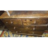 A late 19th Century stained pine chest of two short and two long drawers on a plinth base