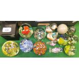 A collection of fifteen various paperweights including animals, millefiore,