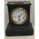 A circa 1900 ebonised pottery cased French mantel clock with circular enamelled dial and Roman