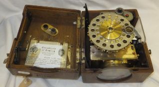 An Easyway pigeon racing clock in an oak case,