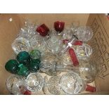 Two decanters, six cranberry coloured custards, an assortment of cut glass wares,