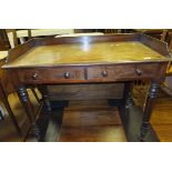 A Victorian mahogany washstand, the three quarter galleried top above two drawers,