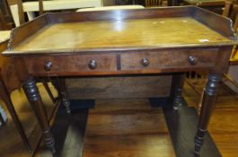 A Victorian mahogany washstand, the three quarter galleried top above two drawers,