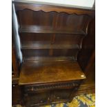 An Old Charm style oak dresser, the plate rack over a single drawer,