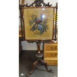 A Victorian rosewood pole screen, the beadwork panel with exotic bird amongst blossom,