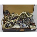 A wooden box decorated with roses,