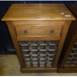 A modern light oak wine rack with single drawer over rack to plinth base