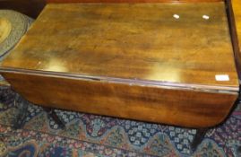 An early 19th Century mahogany drop-leaf Pembroke table with single end drawer on turned and ringed