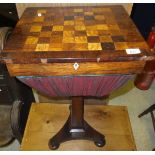 An early Victorian rosewood and inlaid games top sewing table on pedestal tripod base and squat bun