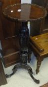 An Edwardian mahogany plant stand,