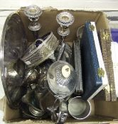 A box containing assorted plated wares to include a pair of candlesticks, butter dish,