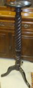 A Victorian mahogany and barley twist carved plant stand on tripod base (bed post conversion)