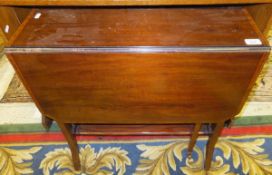 An Edwardian mahogany drop leaf Sutherland table