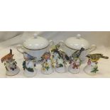 A Noritake porcelain part dinner service with gilt borders to include lidded tureens, bowls, plates,