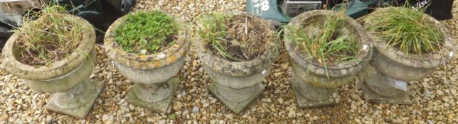 Five composite stone urn shaped planters