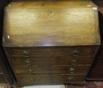 A 19th Century oak bureau, the plain top above a sloping fall enclosing fitted interior,