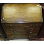 A 19th Century oak bureau, the plain top above a sloping fall enclosing fitted interior,