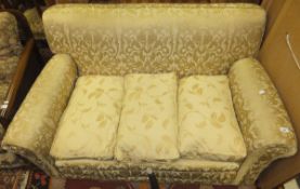 An early to mid 20th Century scroll arm settee with gold upholstery