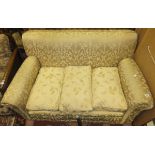An early to mid 20th Century scroll arm settee with gold upholstery
