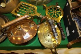 A collection of various metalware to include copper kettle, brass kettle, two brass trivets,