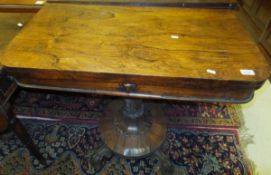 A Victorian rosewood pedestal card table on platform quadruped base