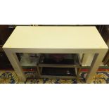 A modern cream console table, a glass topped coffee table,