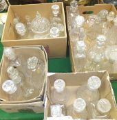 A collection of 32 various decanters, lidded jar,