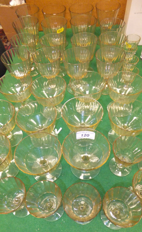 A collection of 39 various Continental facet cut amber glass drinking glasses, wines, liqueurs, etc.