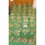 A collection of 39 various Continental facet cut amber glass drinking glasses, wines, liqueurs, etc.