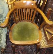An early 20th Century elm and oak framed chair with upholstered seat