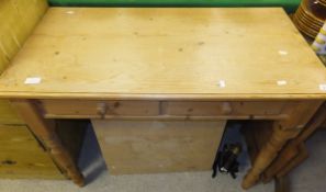 A modern pine side table with two drawers on turned legs, a folding table,