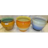 Three Shelley pottery jardiniers, to include one with dripware decoration in green and pale orange,