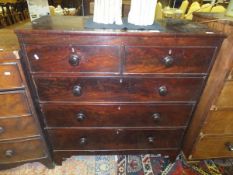 A Victorian mahogany chest of two short and three long graduated drawers with turned knob handles