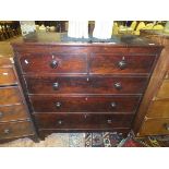 A Victorian mahogany chest of two short and three long graduated drawers with turned knob handles