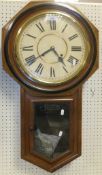 A circa 1900 walnut cased American drop dial wall clock by The Ansonia Clock Co.