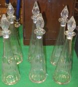 A set of six 19th Century Continental glass conical spirit decanters with stoppers,