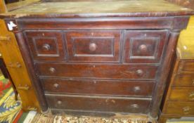 A Victorian mahogany bonnet chest with cushion drawer over three short deep drawers and three long