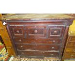 A Victorian mahogany bonnet chest with cushion drawer over three short deep drawers and three long