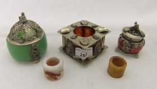 A Chinese white metal mounted ash tray, two white metal mounted perfume pots, a jade archery ring,