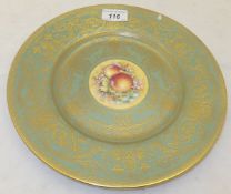 A Royal Worcester cabinet plate painted with fruit by T Nutt on a celadon and gilt decorated ground,