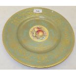 A Royal Worcester cabinet plate painted with fruit by T Nutt on a celadon and gilt decorated ground,