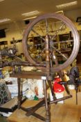 A 20th Century stained walnut spinning wheel