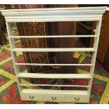 A white painted pine plate rack with drawers to base