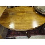 A 19th Century rosewood oval centre table on octagonal pedestal to shaped base and casters