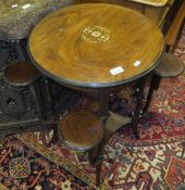 An Edwardian rosewood and inlaid occasional table, the circular top on turned supports,