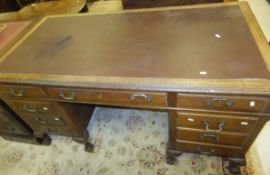 A mahogany kneehole desk,