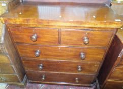 A Victorian mahogany chest of two short over three long drawers with turned wooden handles,